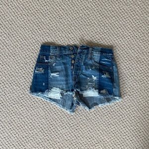Distressed two-tone jean shorts
